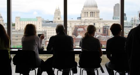 4 people sitting at the table with view on St. Paul's Cathedral London