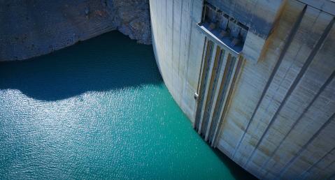 dam wall surrounded by water
