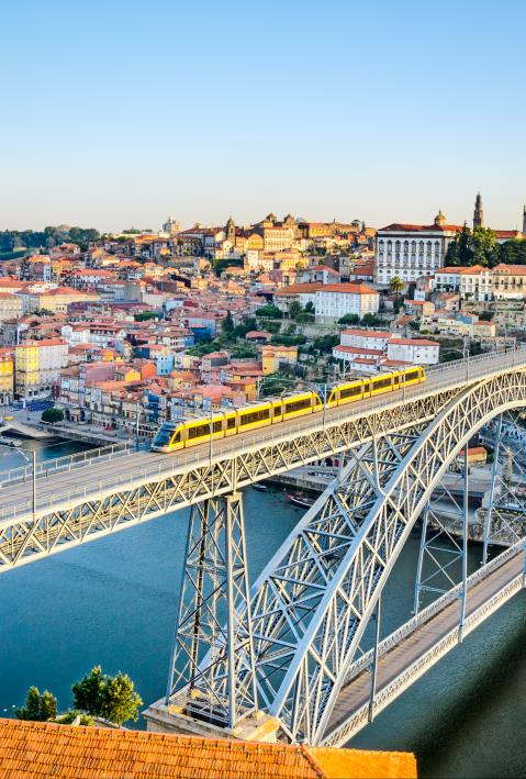 view of the iconic bridge in the city of Porto in Portugal