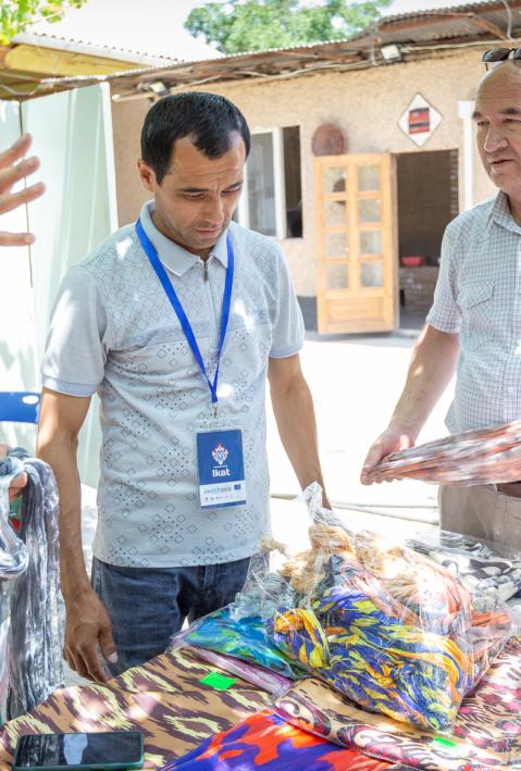 Three ikat producers at the Atlas Adras Festival in Tajikistan discuss their colourful woven silk fabrics.