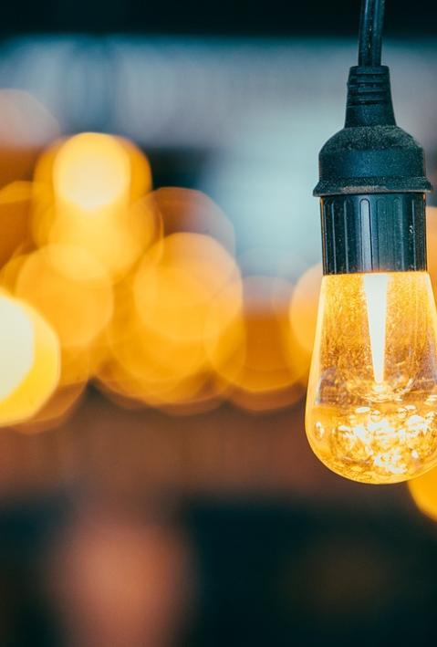 a light bulb in the foreground, with others being blurred in the background