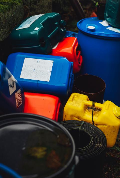 Colorful containers lie in a heap. 