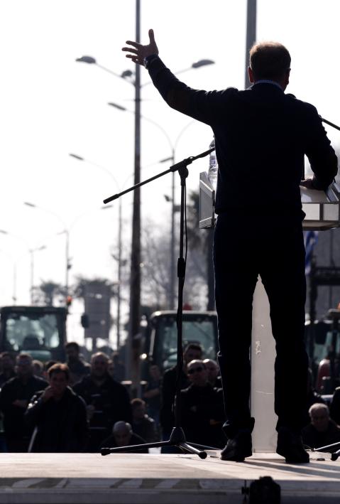 Thessaloniki, Greece - February 1, 2018. The silhouette of a farmer is seen, as he holds a speech during a farmers protest against their income cuts