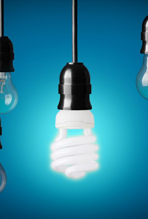 Energy saving and simple light bulbs.Blue background