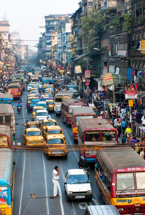 CALCUTTA, INDIA - JAN 18: Many private cars, yellow cabs and public buses on the street traffic jam on January 18, 2013 in Kolkata, India. Kolkata has a density of 814.80 vehicles per km road length 