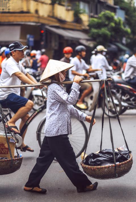 Hanoi, Vietnam - May 2, 2015: Vietnamese street market lady seller, on May 2, 2015, in Hanoi, Vietnam