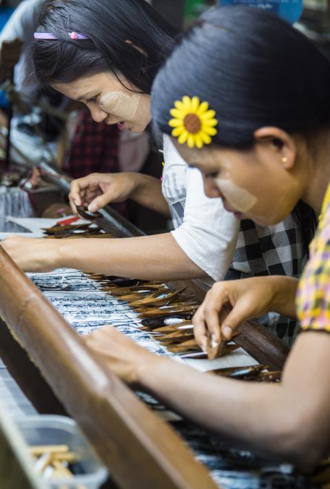 Mandalay Myanmar - Dec 2016: Visiting the silk weaving center, where skillful workers were producing premium hand-made grade goods