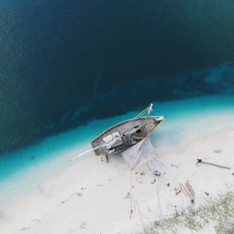 bird's eye view on a stranded boat on a shore in Haiti