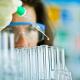 lab technician pipette liquid into test tubes